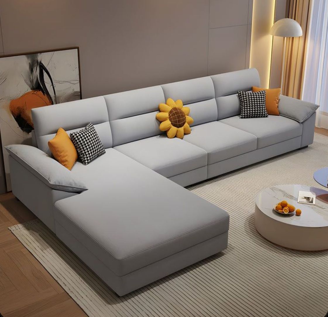 Skilled craftsman working on sofa upholstery